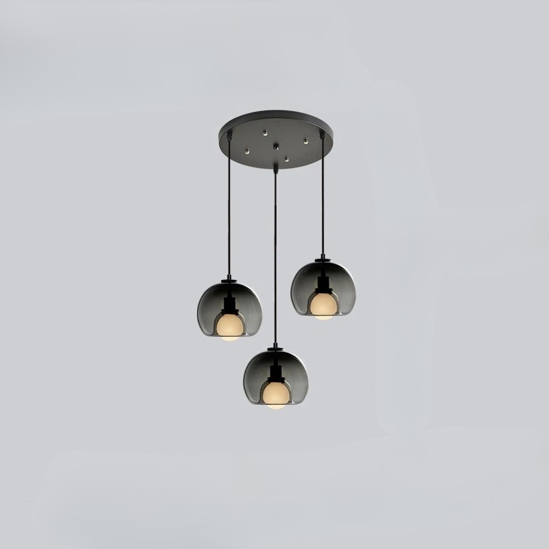 Orbis pendant light with Nordic-inspired glass design casting warm ambient glow for modern interiors