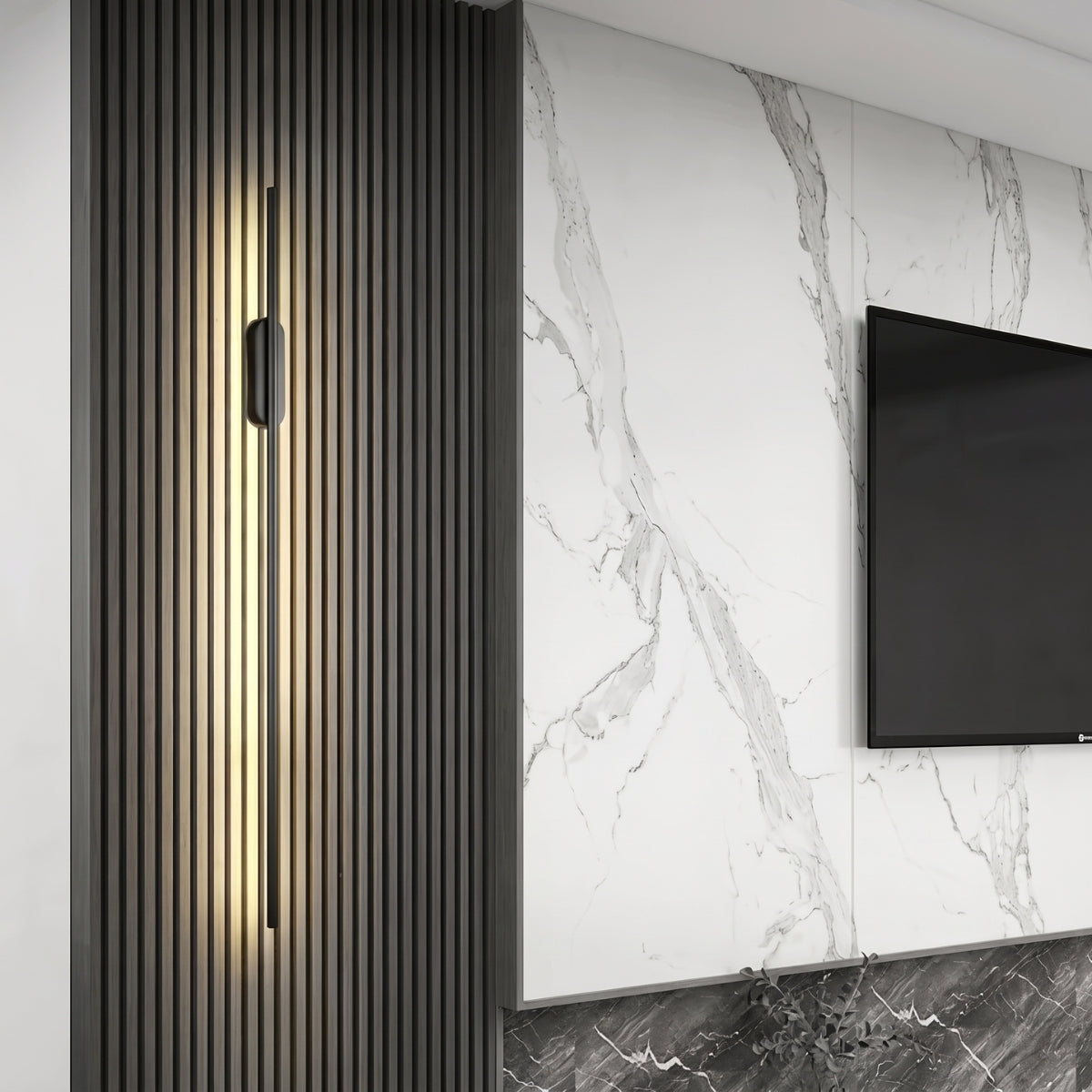 A vertical black linear wall light installed on a dark slatted wood accent wall, next to a white marble wall with a mounted TV.