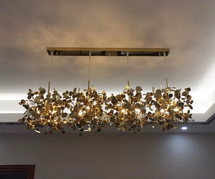 High-quality stainless steel Aurora chandelier with G9 light sources, available in Golden and Chrome finishes. Perfect for living rooms, dining rooms, bedrooms, villas, and lobbies, this versatile design blends luxury and functionality for a brilliant and inviting ambiance.