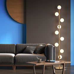 Lights of Scandinavia - Nucleic - Modern LED standing lamp with frosted glass ball fixtures. Nickel gold plated steel body. Suitable for bedrooms, halls or next to a lonely wall.  9 light sources with a coverage of approximately 6-12 square meters, using the included LED Bulbs. Base diameter: 25cm Glass ball diameter: 10cm Specifications Light Source 9x LED Bulbs Base Type G4 Power Consumption 16-20W Is Bulbs Included Yes Dimmable